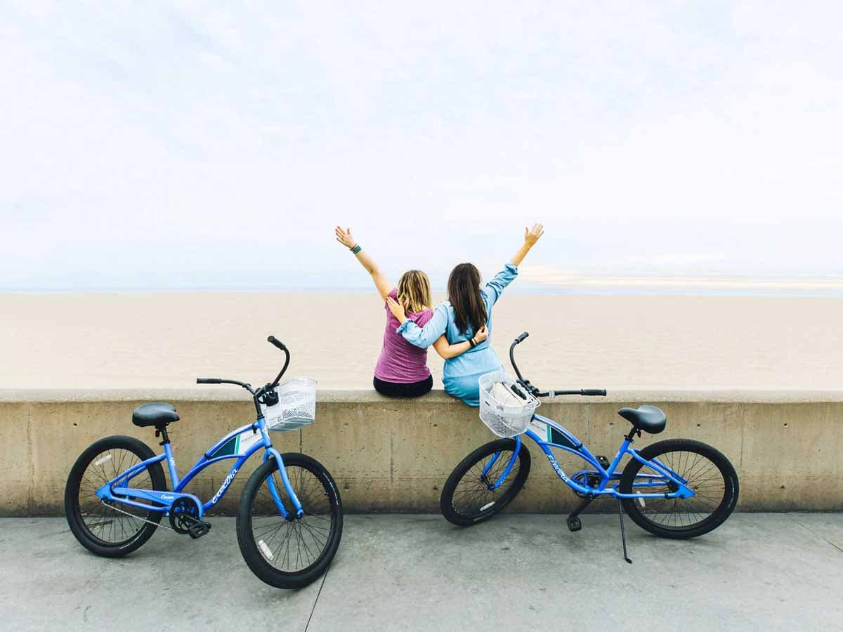 Girls on bike at the beach